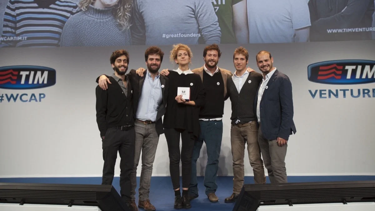 Il team sul palco di Working Capital (Telecom Italia) dopo la vittoria del 1° premio — Milano 2014